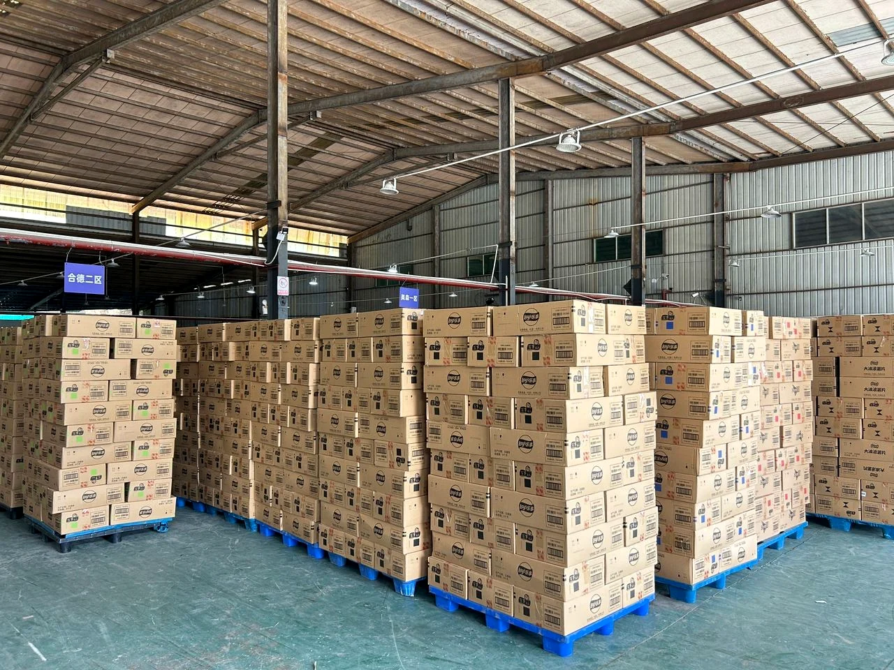 Warehouse floor with boxed inventory on pallets